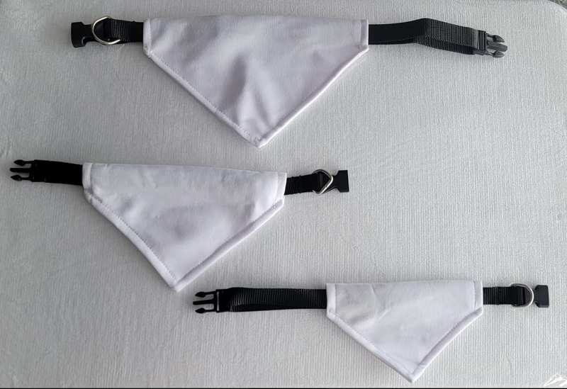 Group of white triangular buckle dog scarves in several sizes