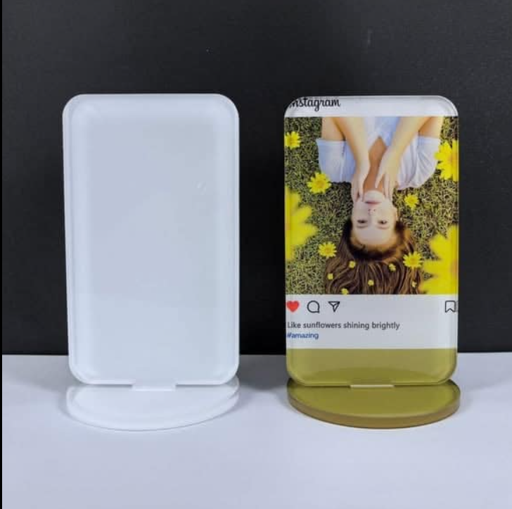 clear acrylic photo frame blank on its stand.
