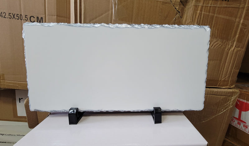 Horizontal rectangular rock slate blank with irregular edges and two black support feet