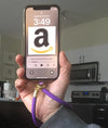 Polyester Sublimation Phone Wrist Strap Lanyard in Use - Purple Custom Lanyard Attached to Smartphone Being Held - Demonstration of Phone Accessory Function - Wholesale Sublimation Blanks Canada